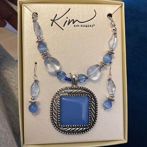 This beautiful and unused necklace set that also comes with matching earrings!